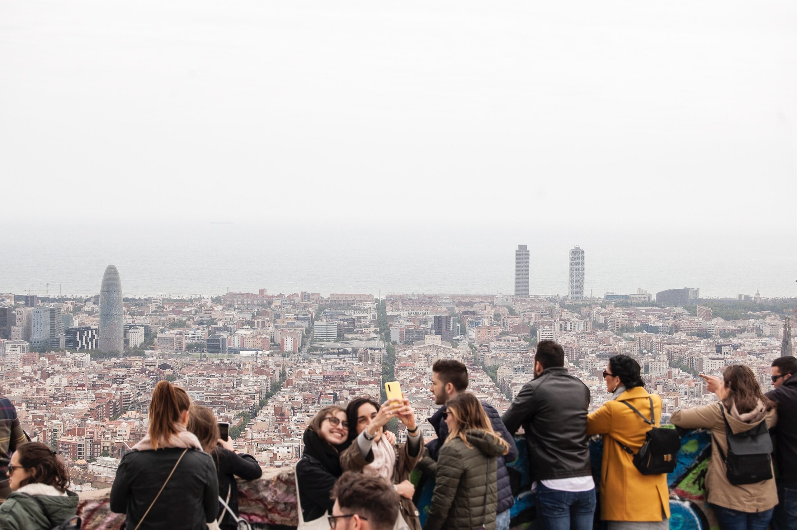 people standing and looking on buildings during daytime