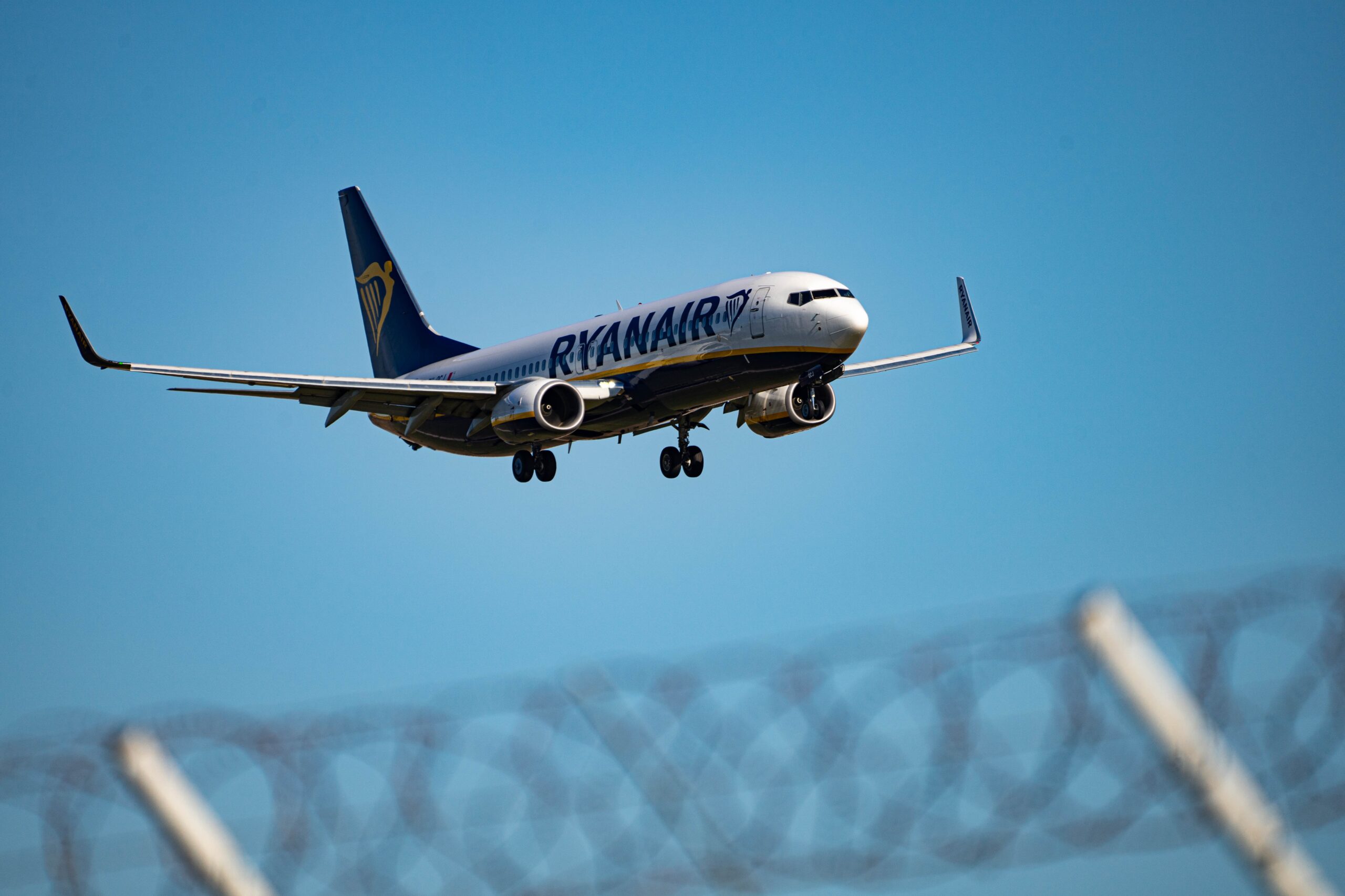 white and blue passenger plane in flight