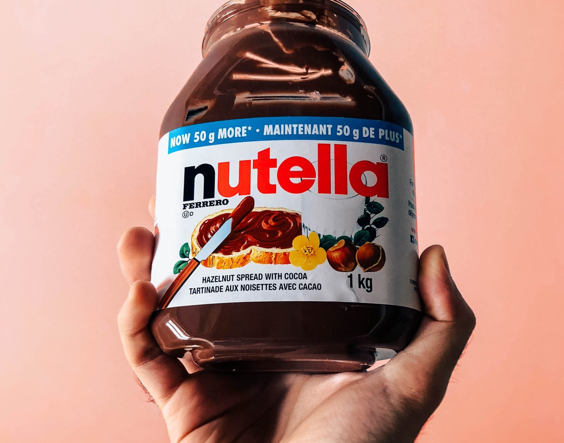 person holding Nutella jar