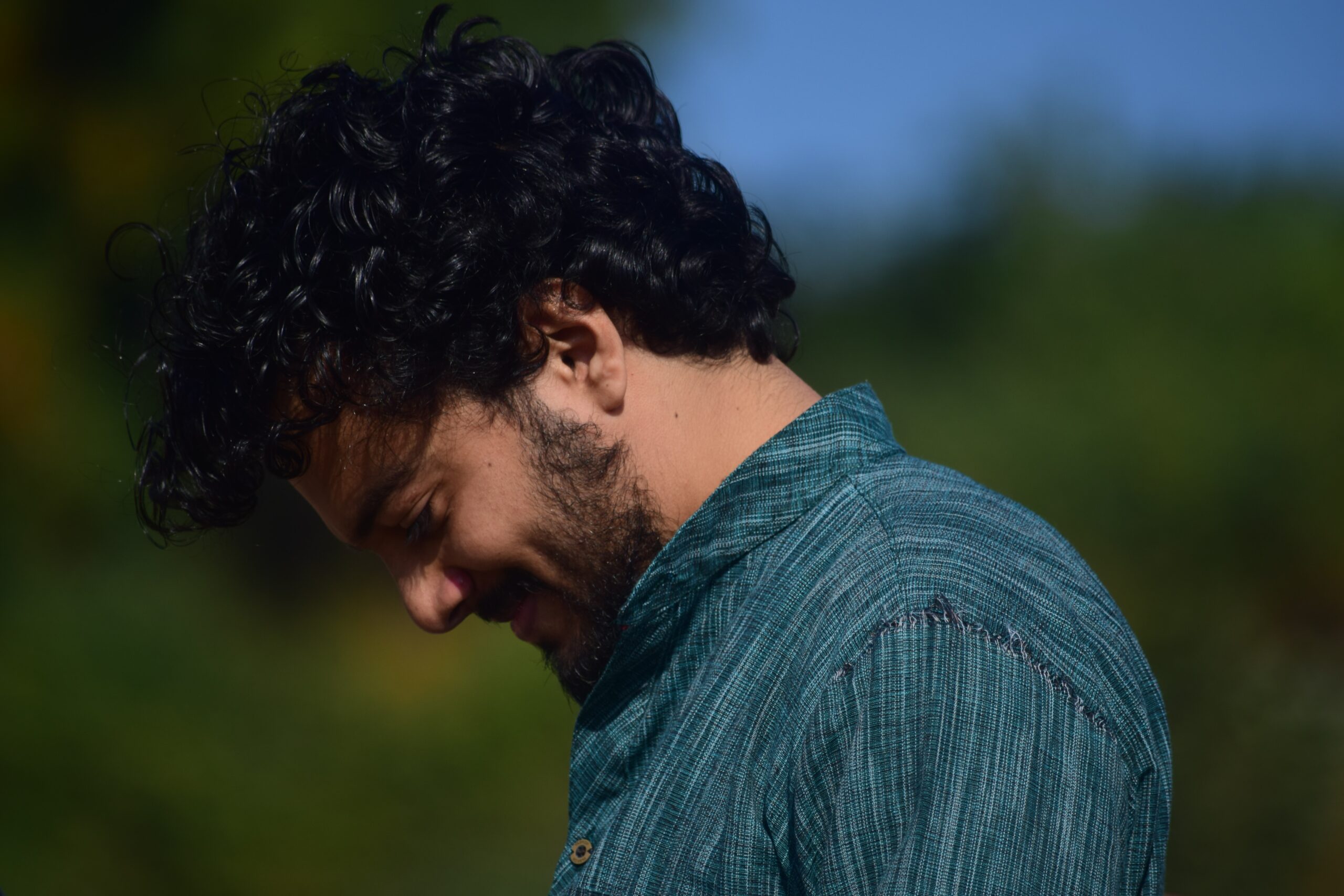 selective focus photography of man looking down