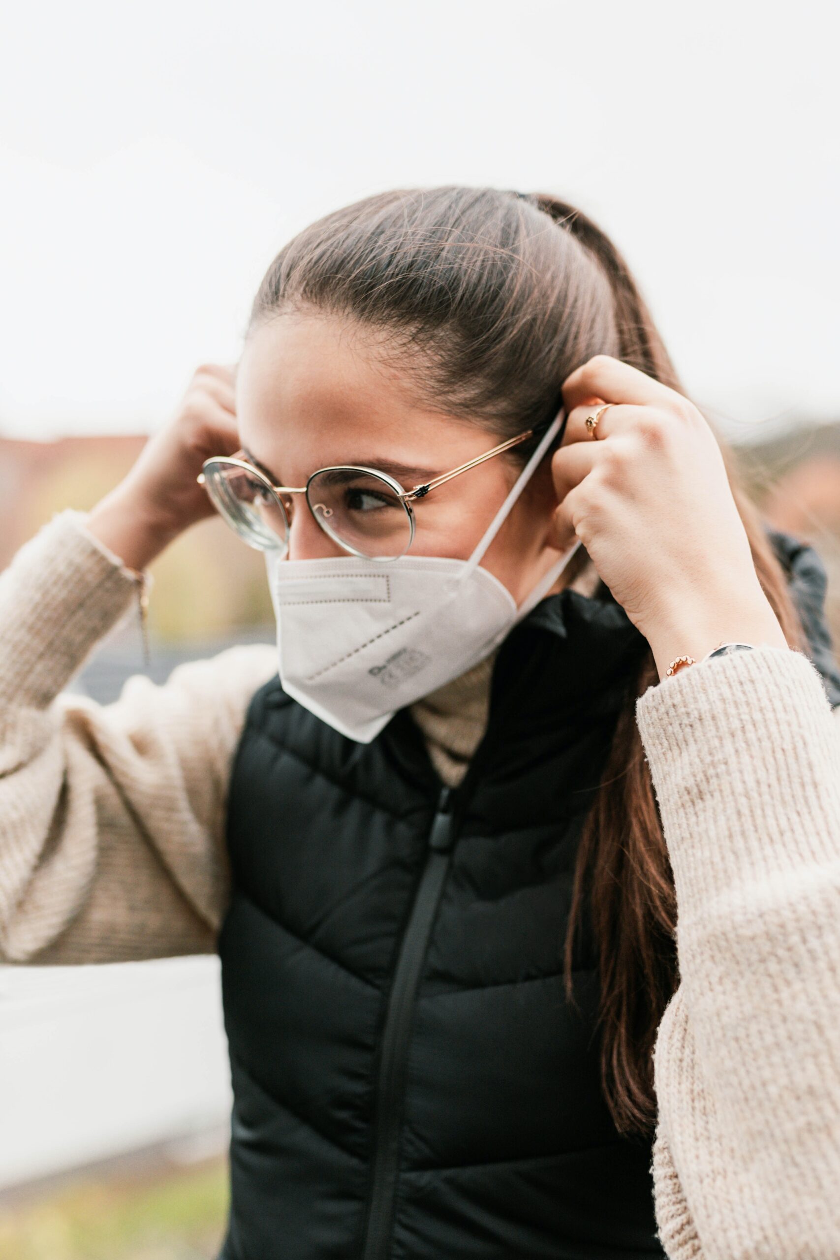 One of our employees putting on a FFP2 mask outside our offices in Hameln, Germany, captured by Lisa Heeke.