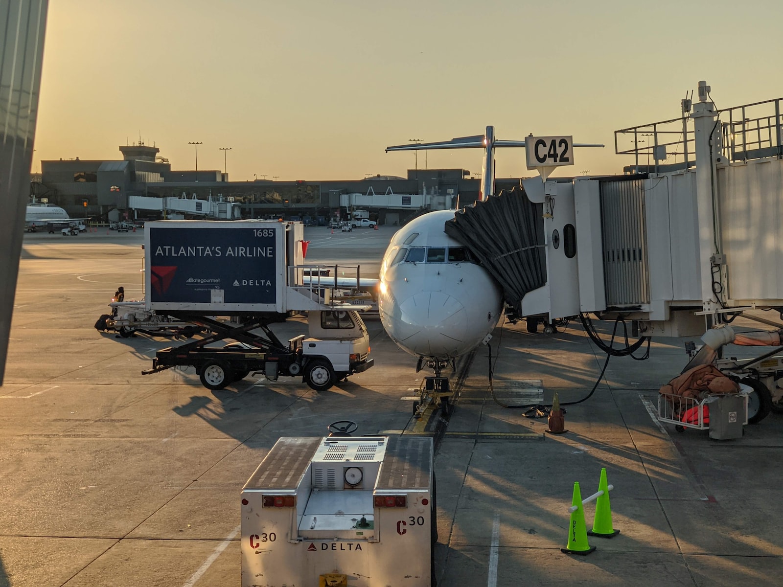 white and blue airplane on airport during daytime