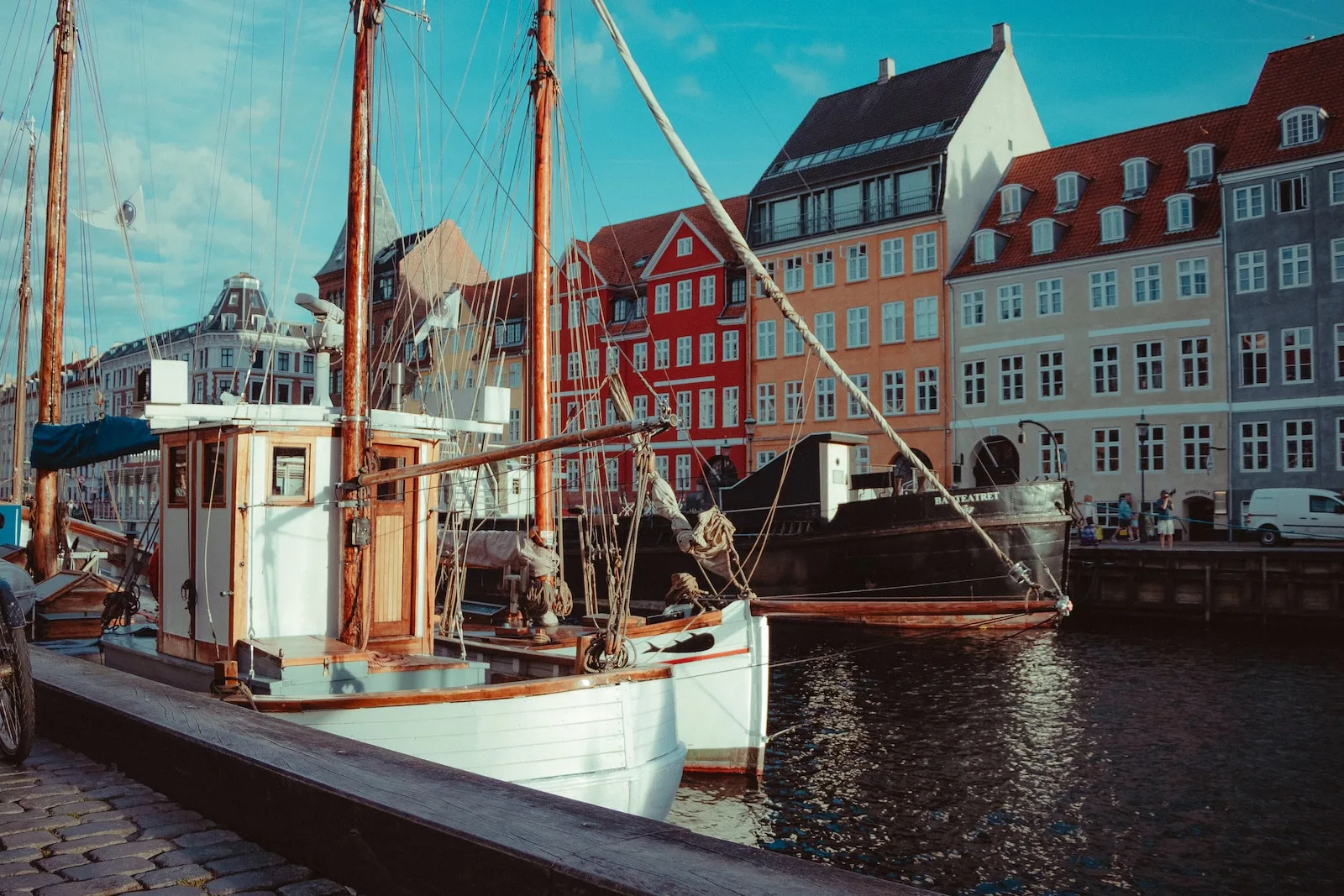 white and brown boat on dock during daytime