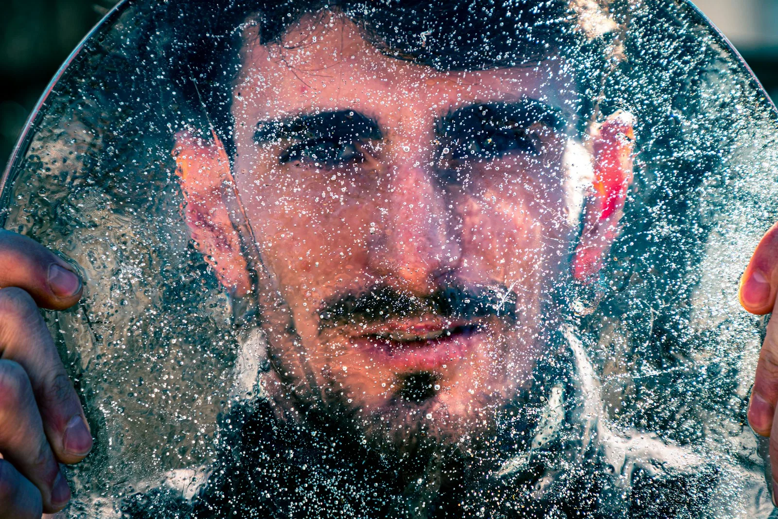 mans face on water
