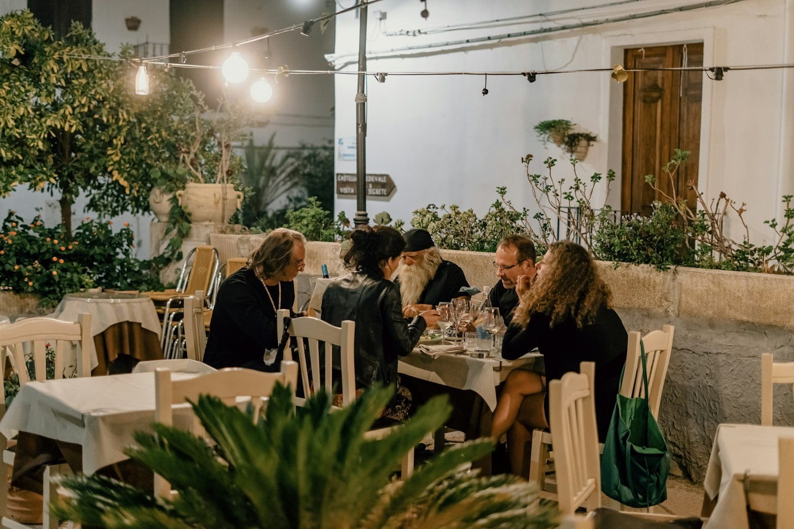 people sitting on chairs inside restaurant