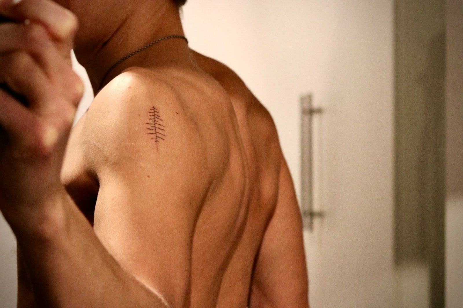 A man is taking a picture of himself in the mirror