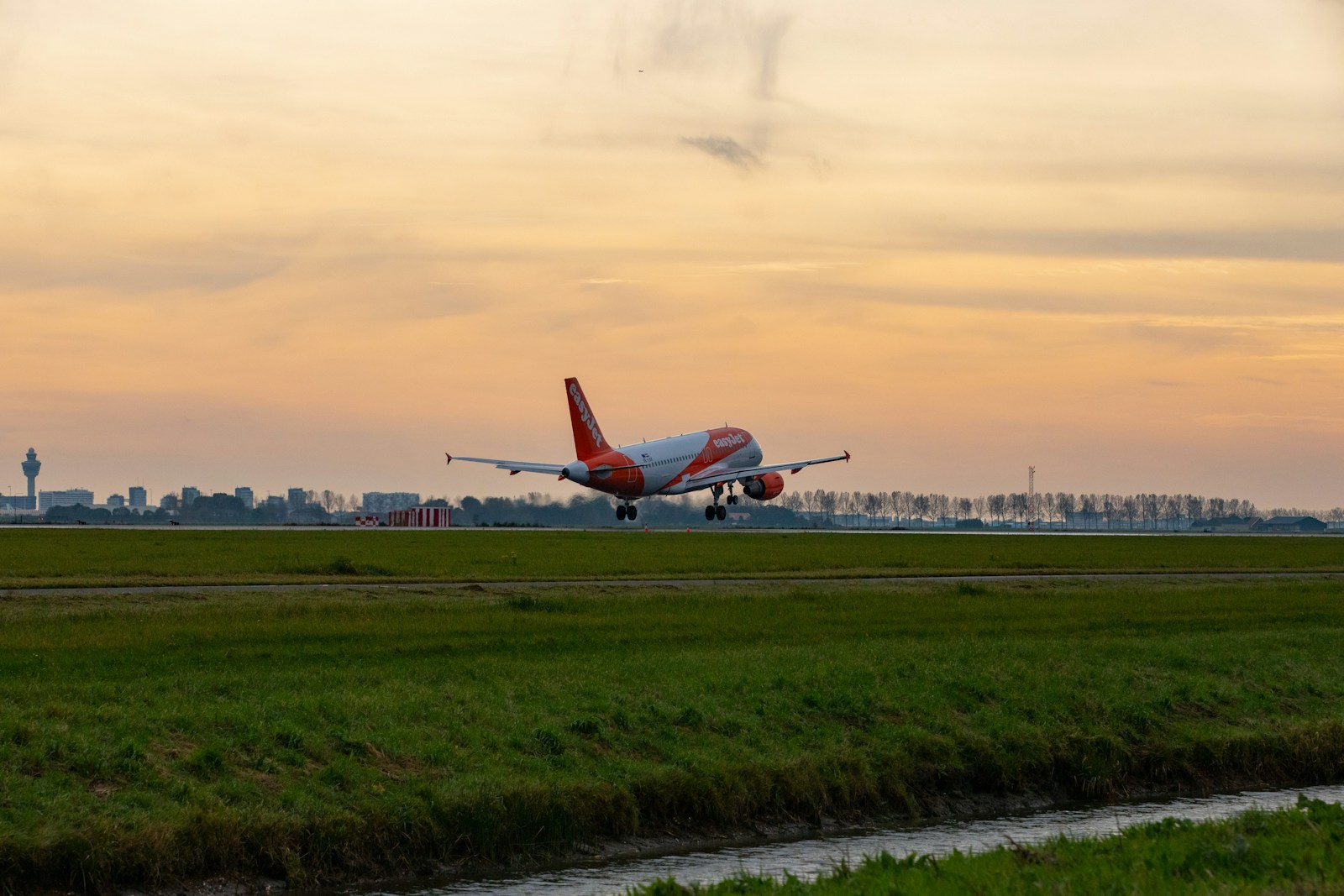 a large jetliner taking off from an airport runway