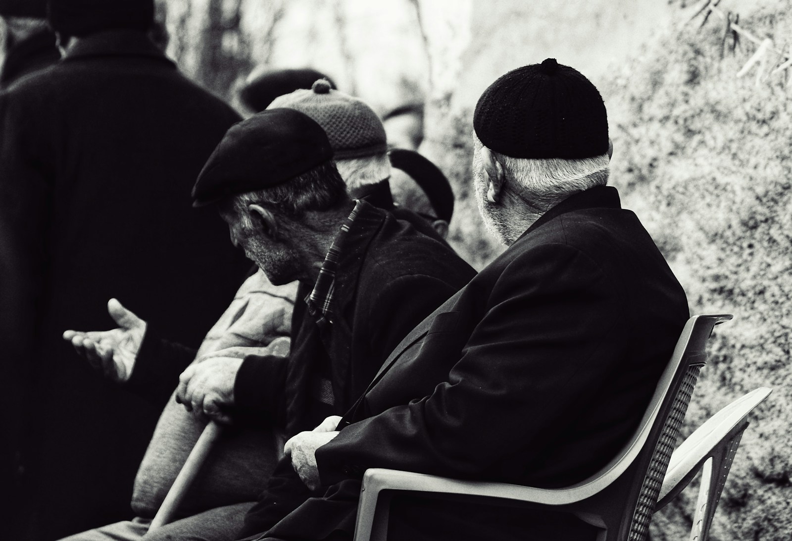 a group of men sitting next to each other