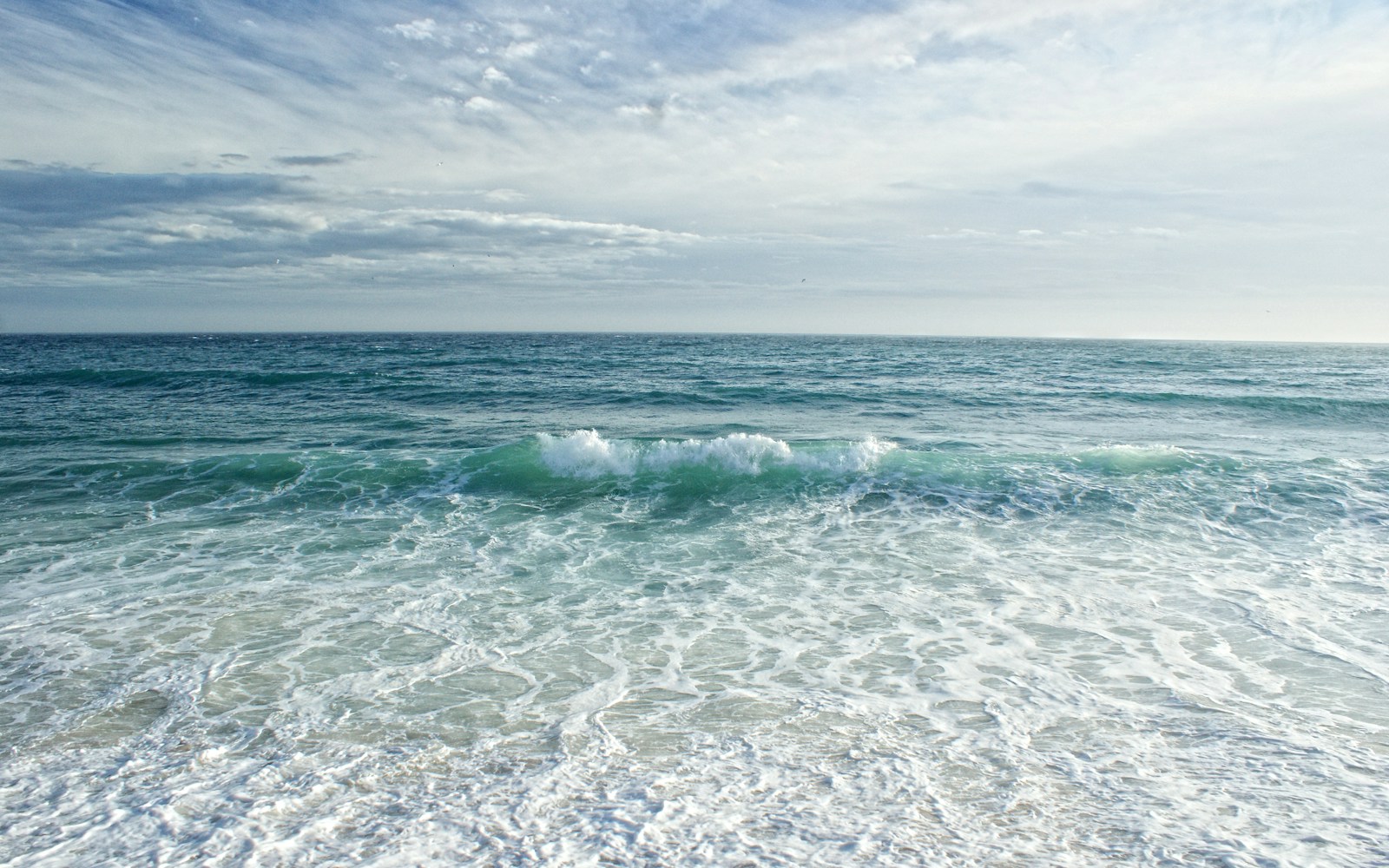 a view of the ocean from the shore