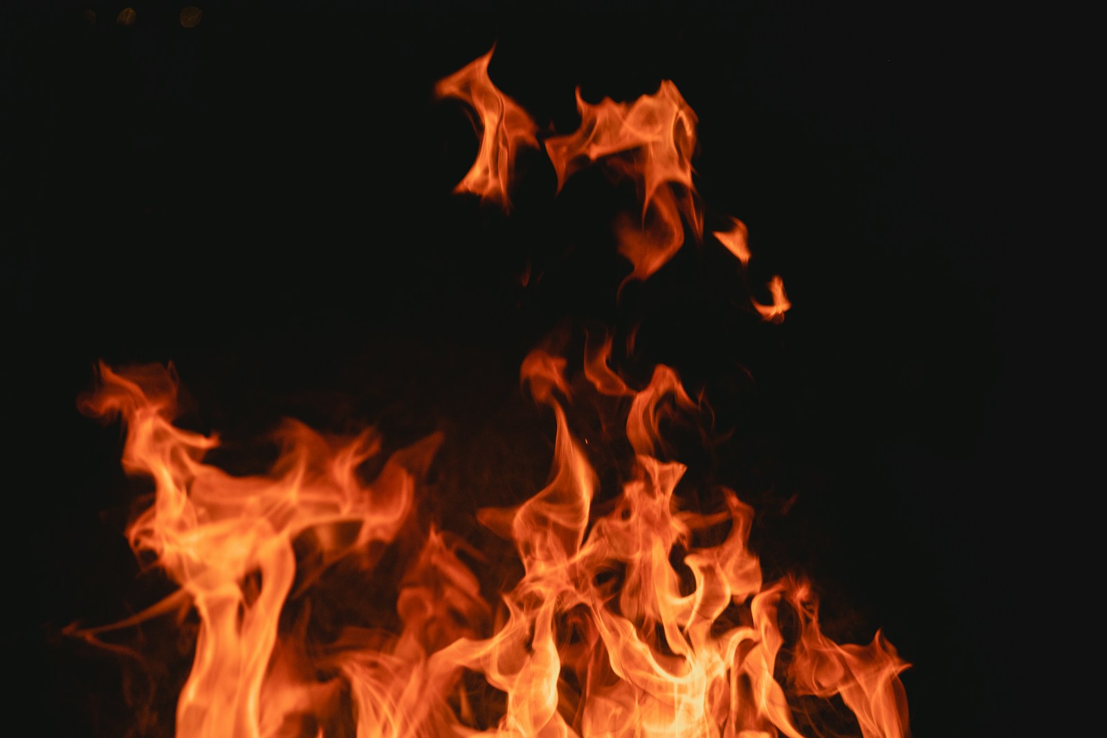 a close up of a fire in the dark