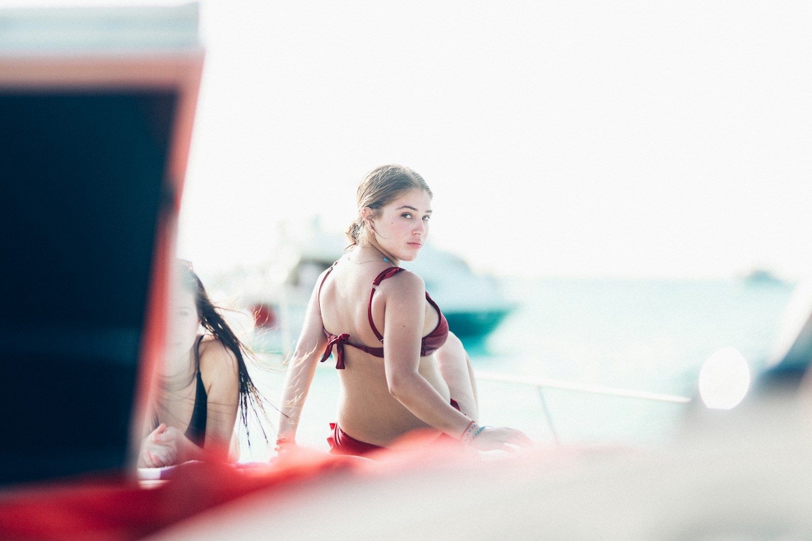 woman wearing red bikini looking over her right shoulder