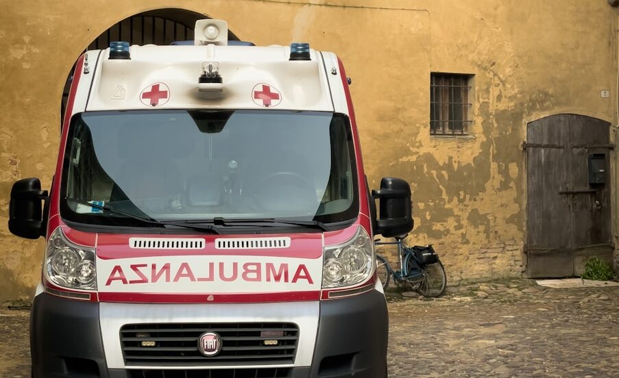 An ambulance is parked in an old building.