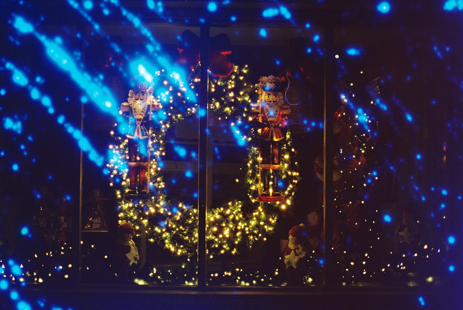 Christmas decorations with glowing lights and blue bokeh