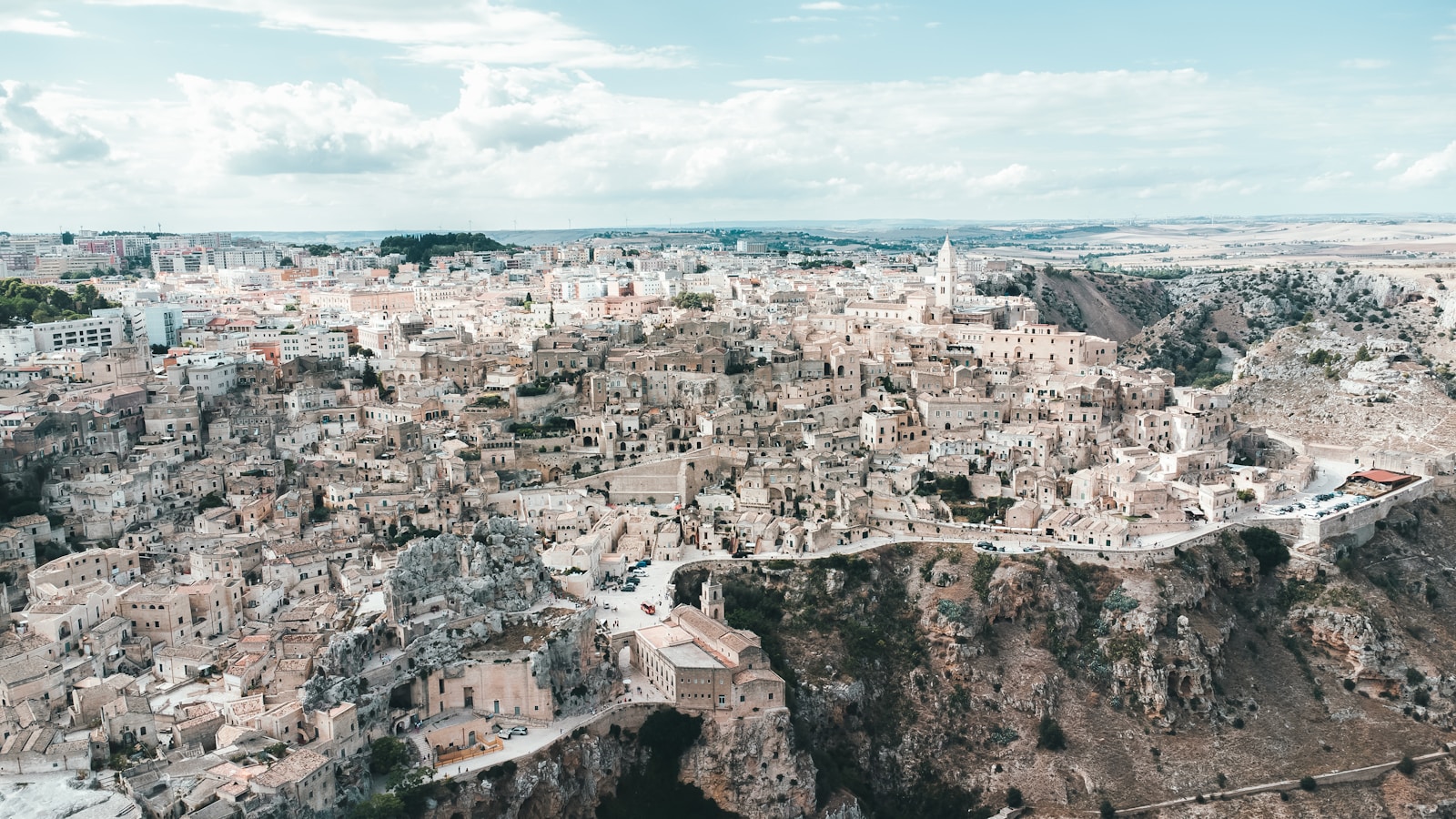 An aerial view of a city with a mountain in the background