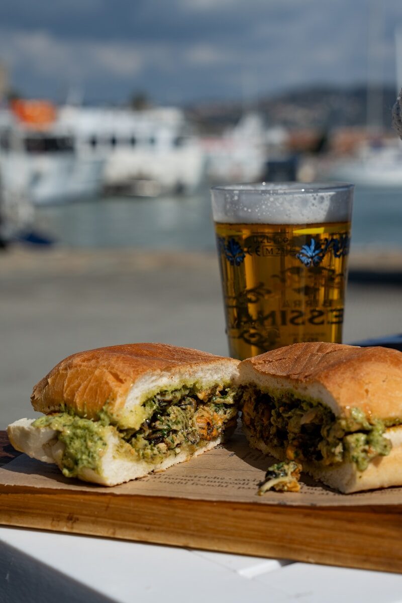 Sandwich and beer enjoy a harbor view.