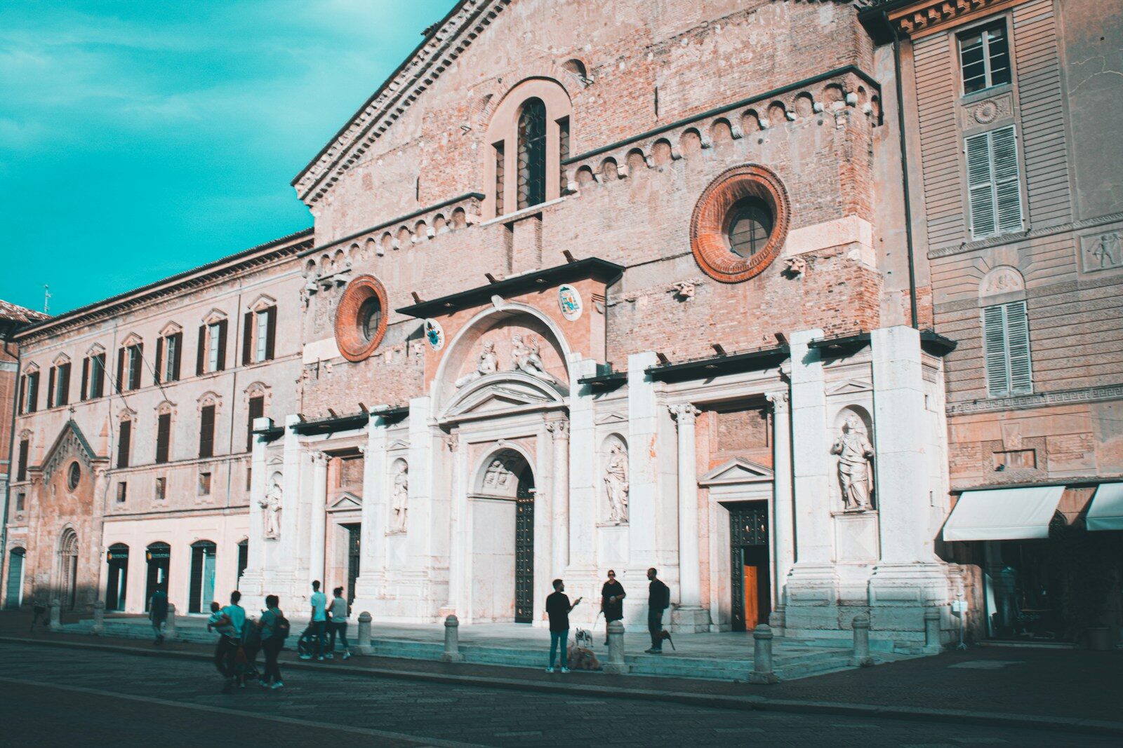 a group of people standing in front of a building